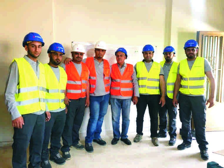 Everest World Lifts technical team wearing safety equipment